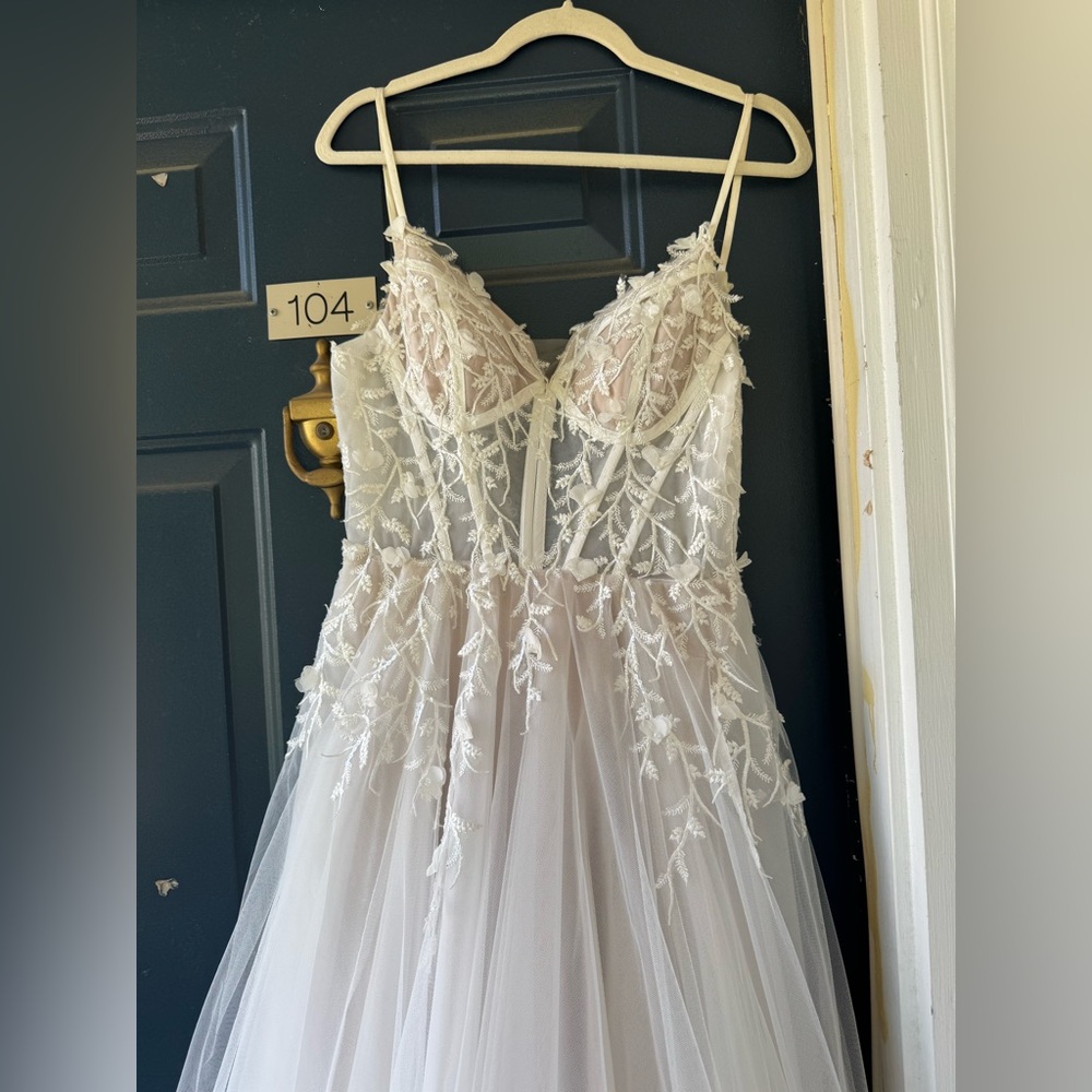 White Wedding Gown With Vine-Like Embellishments